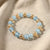 Dual-Tone Crystal Beaded Stretch Bracelet – Elegant Slip-On Design